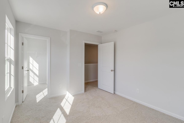 empty room featuring light colored carpet