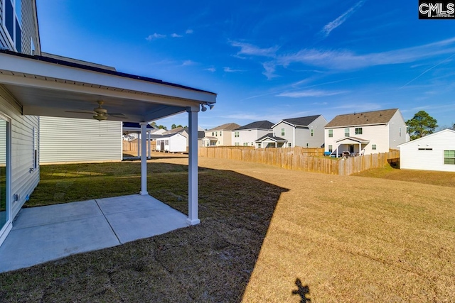 view of yard featuring ceiling fan and a patio area