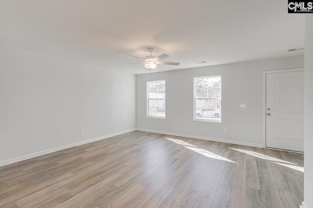 unfurnished room with ceiling fan and light wood-type flooring