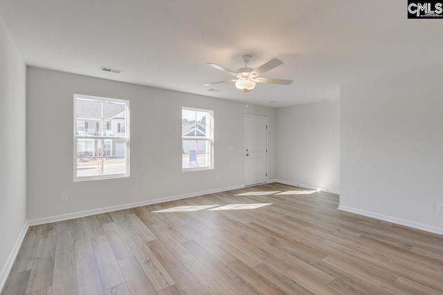 unfurnished room with ceiling fan and light wood-type flooring