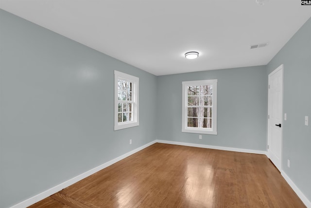 spare room featuring hardwood / wood-style flooring