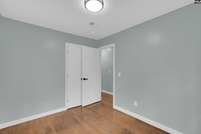 unfurnished bedroom featuring light wood-type flooring