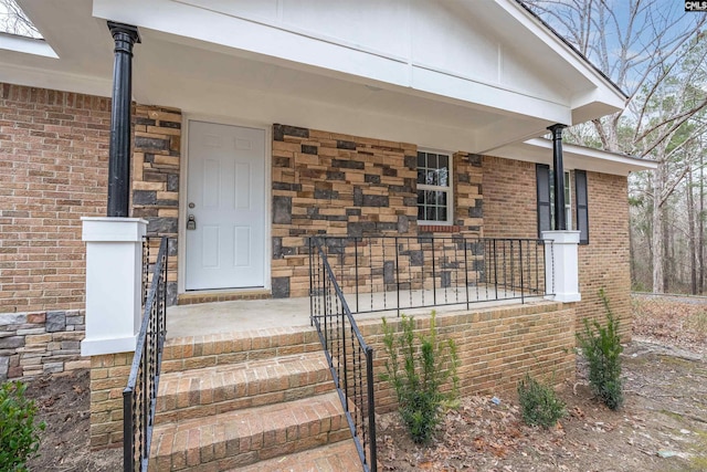 doorway to property with a porch