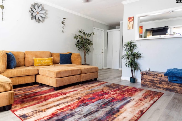 living room featuring ornamental molding and wood finished floors