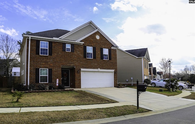 view of front facade featuring a garage and a front yard