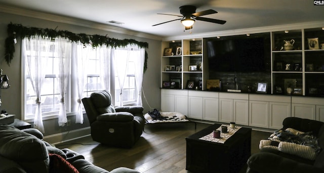 living room with crown molding, ceiling fan, and wood-type flooring