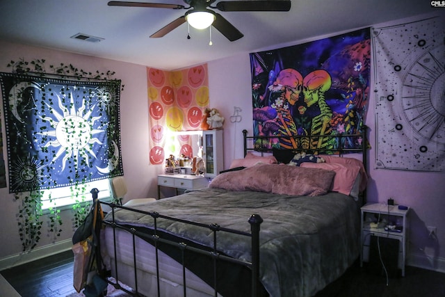 bedroom with ceiling fan and hardwood / wood-style floors