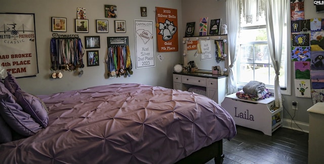 bedroom featuring dark hardwood / wood-style flooring