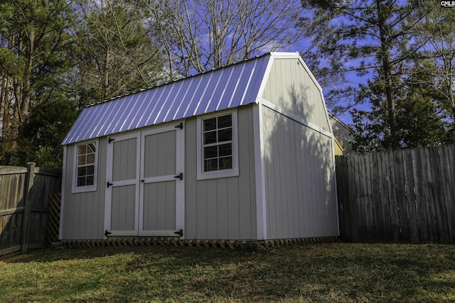 view of outbuilding featuring a yard