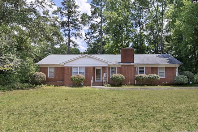 ranch-style home with a front lawn