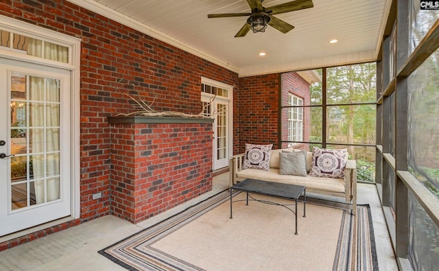 sunroom / solarium featuring wood ceiling and ceiling fan