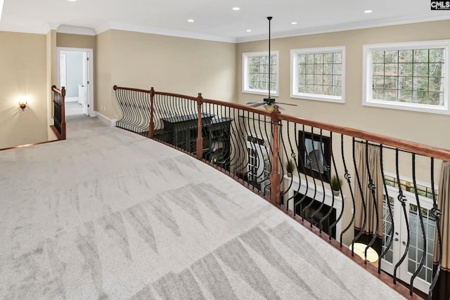 hallway featuring ornamental molding