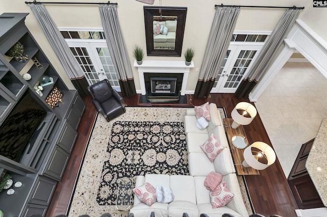 living room featuring french doors and hardwood / wood-style flooring