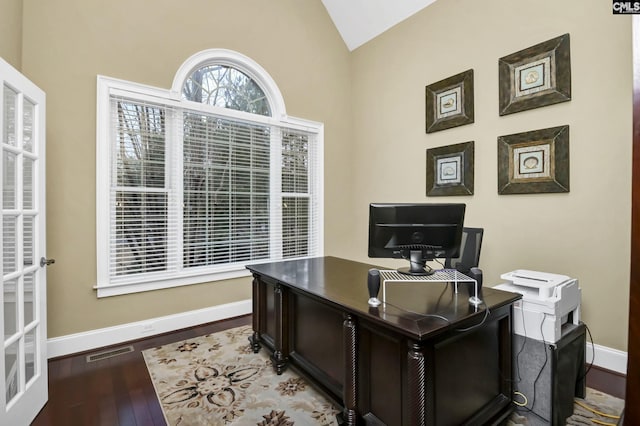 office with hardwood / wood-style flooring and vaulted ceiling