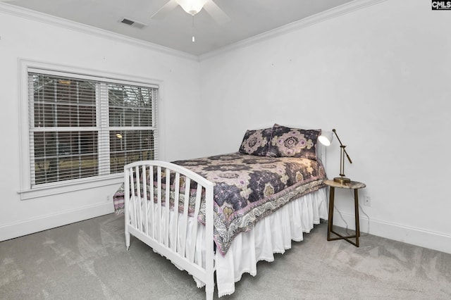 bedroom featuring crown molding, ceiling fan, and carpet floors