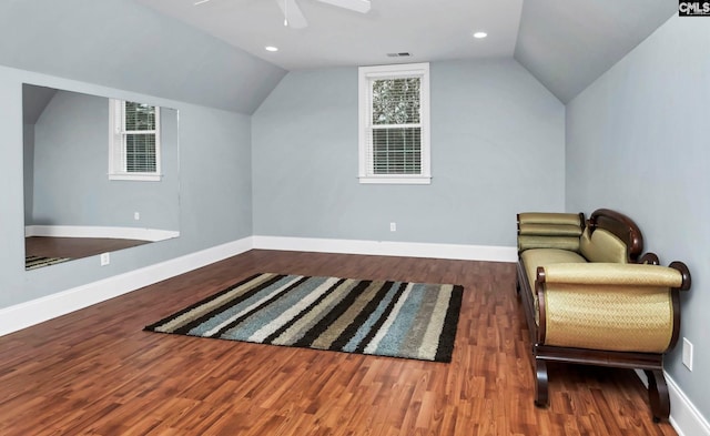 sitting room featuring dark hardwood / wood-style flooring, vaulted ceiling, and ceiling fan