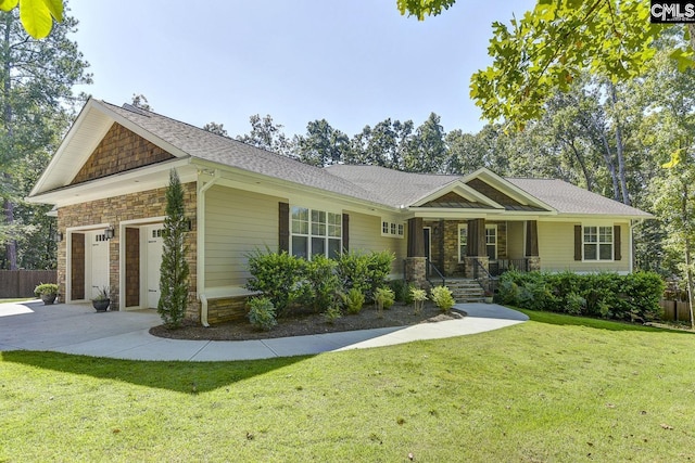 view of front facade featuring a garage and a front lawn