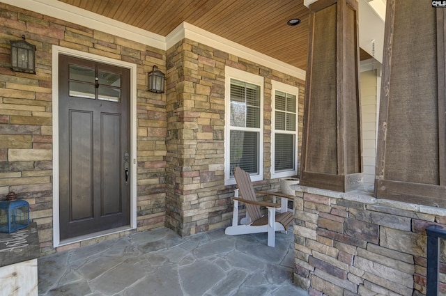 doorway to property with a porch