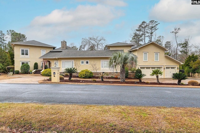 view of front of property with a garage