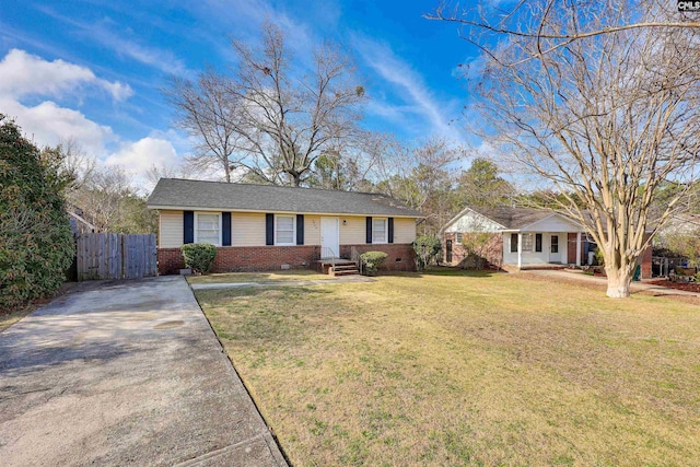 ranch-style home with a front yard