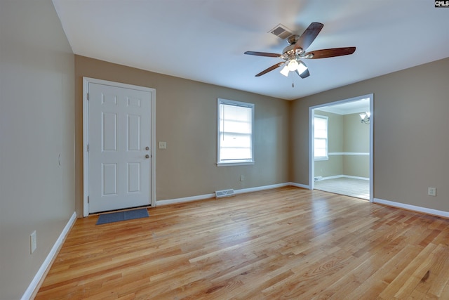 spare room featuring ceiling fan and light wood-type flooring