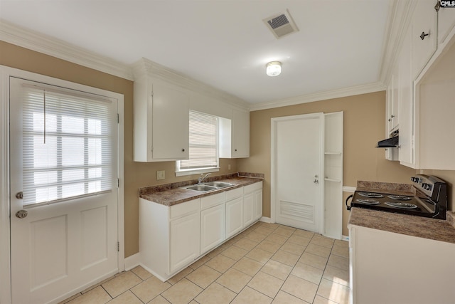 kitchen featuring sink, crown molding, light tile patterned floors, electric stove, and white cabinets