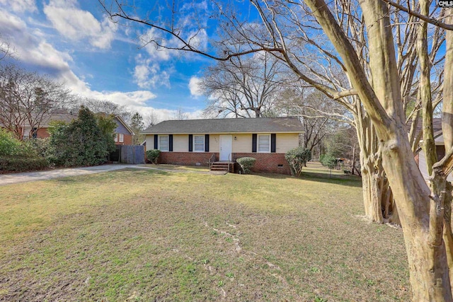 ranch-style home featuring a front yard