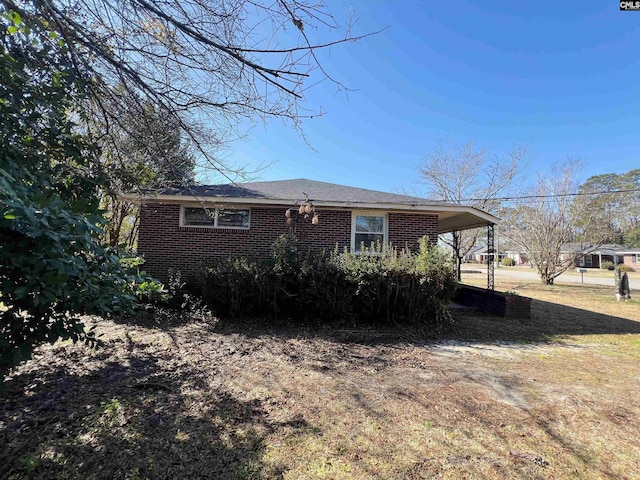 exterior space featuring a carport