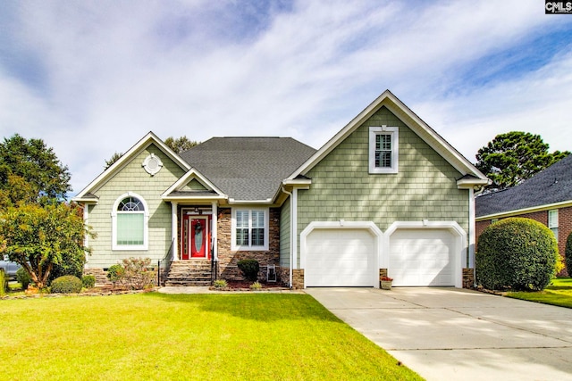 view of front facade with a garage and a front yard