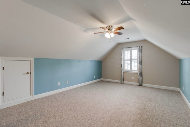 additional living space with vaulted ceiling, ceiling fan, and carpet