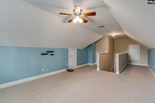 bonus room featuring lofted ceiling, carpet flooring, and ceiling fan