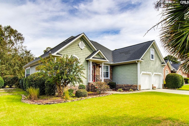 view of front of home featuring a garage and a front yard