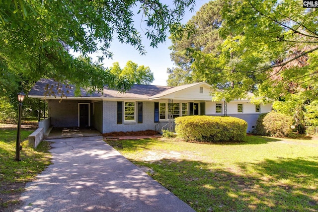 single story home with a carport and a front yard