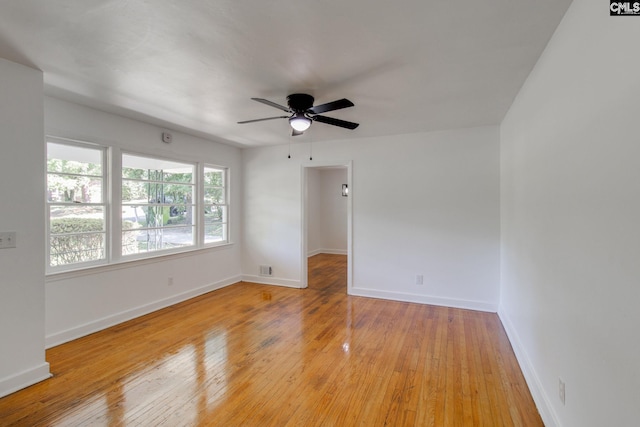 unfurnished room with ceiling fan and light wood-type flooring