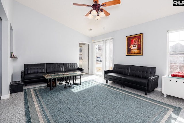 living room with vaulted ceiling, carpet flooring, and ceiling fan