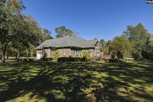 view of property exterior featuring a lawn