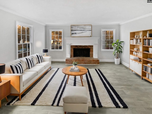 living room featuring a fireplace, ornamental molding, and plenty of natural light