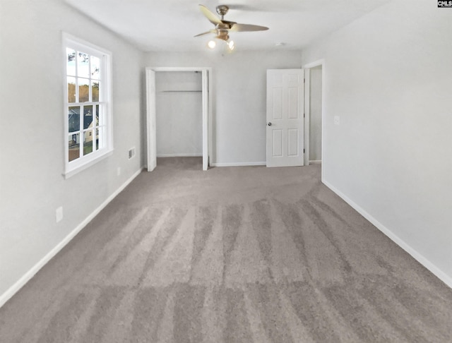 unfurnished bedroom with carpet flooring and ceiling fan