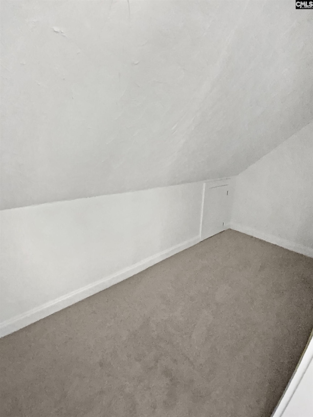 bonus room featuring vaulted ceiling