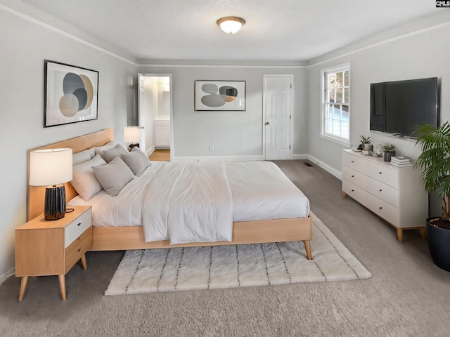 carpeted bedroom with ensuite bathroom