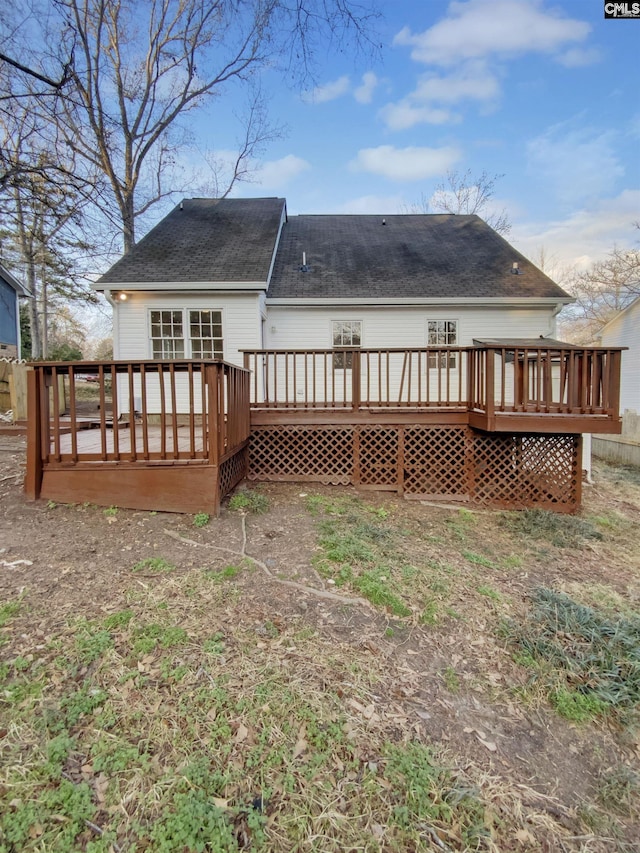 rear view of house with a wooden deck