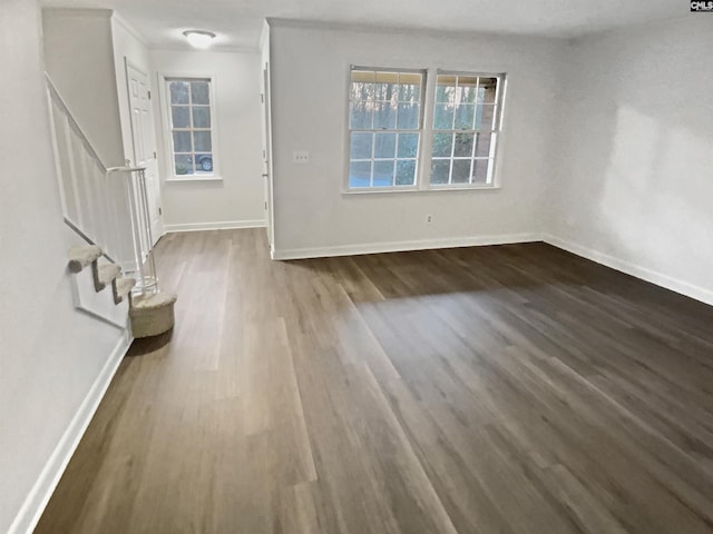 interior space with crown molding and dark hardwood / wood-style floors