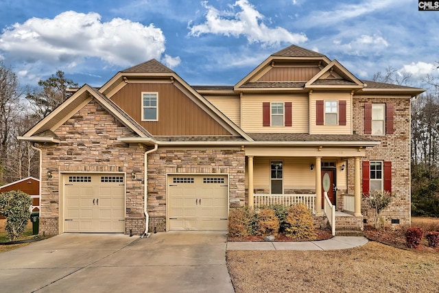 craftsman-style house featuring a porch and a garage