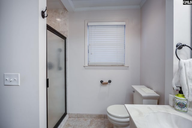 bathroom featuring tile patterned floors, toilet, ornamental molding, vanity, and a shower with door