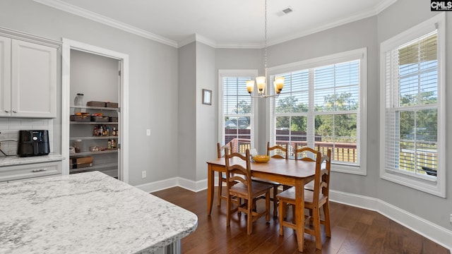 dining area with crown molding, dark wood-type flooring, and a healthy amount of sunlight