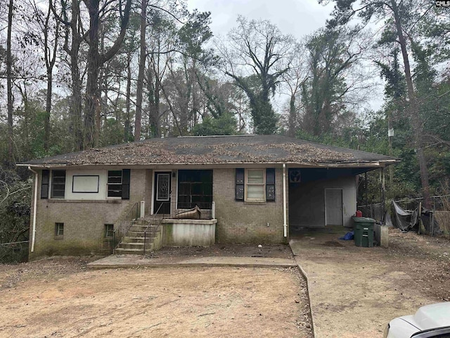 view of front facade with a carport