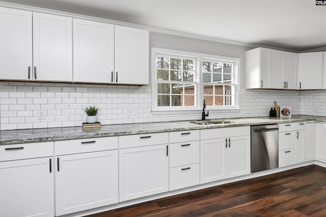 kitchen featuring sink, white cabinetry, backsplash, light stone countertops, and stainless steel dishwasher