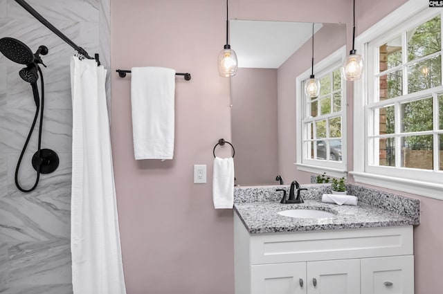 bathroom featuring vanity and a shower with shower curtain