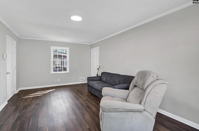 living room featuring crown molding and dark wood-type flooring