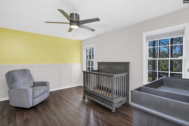 bedroom featuring dark hardwood / wood-style flooring and ceiling fan